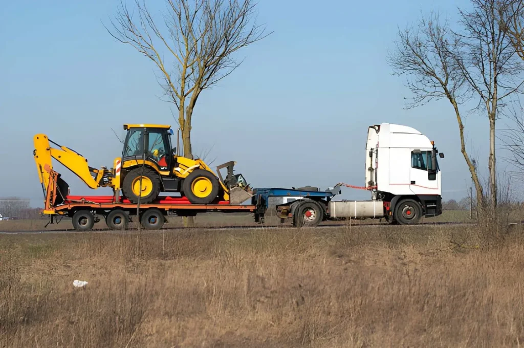 Machinery being transported on a flatbed truck